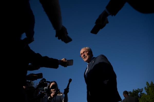 Senate Majority Leader Chuck Schumer addresses reporters outside the White House May 9, 2023. 