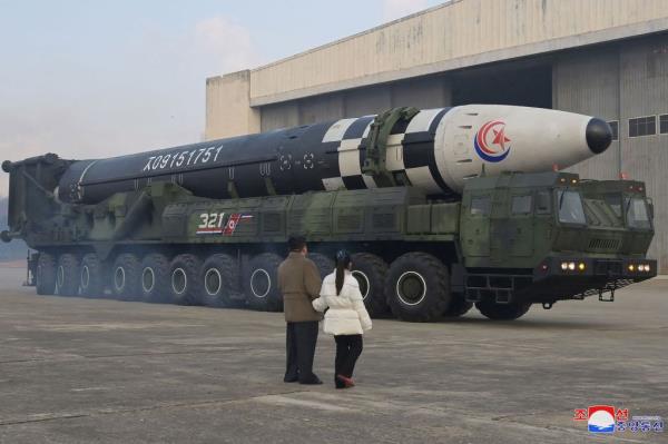 Kim and his daughter expect one of the kingdom's many new missiles.