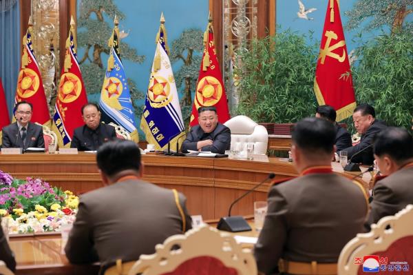 Kim Jong Un smiles as chairs meeting of the ruling Workers’ Party’s Central Military Commission on Monday.