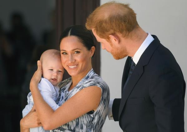 Meghan and Harry with child