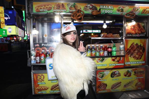 Meg Superstar Princess smoking at a food cart